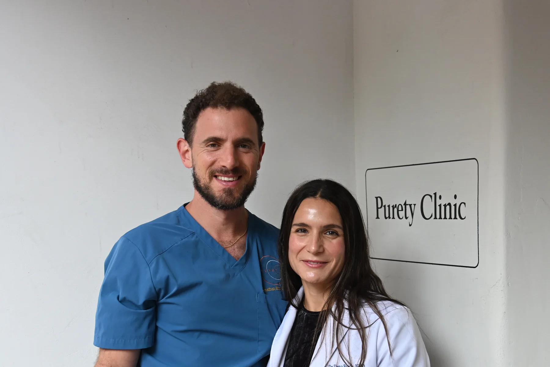 Dr. Jonathan Birch and Dr. Dena Birch together outside Purety Clinic